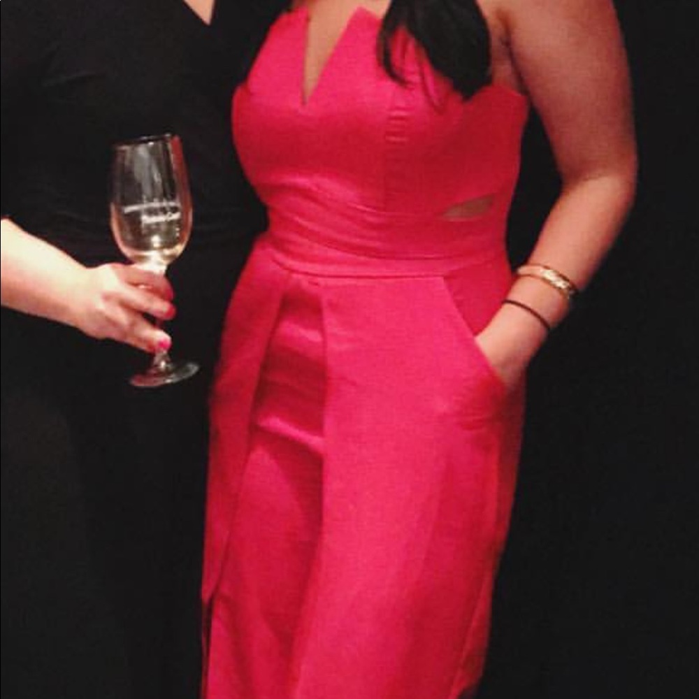 Bright red strapless cutout jumpsuit with side leg slits